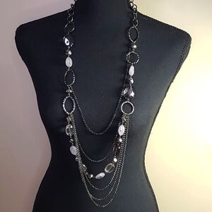 Gunmetal chain with silver hoops and swirly white and black amethyst beads.